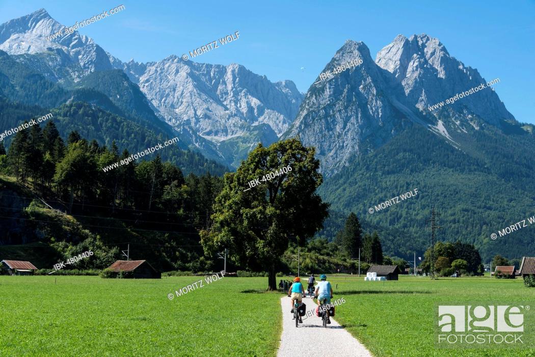 Stock Photo: Cyclists on bike tour, cycle path with mountain bike, behind Zugspitze, Tegernauweg, near Grainau, crossing the Alps, Garmisch-Partenkirchen, Upper Bavaria.
