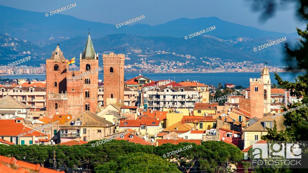 Stock Photo: The medieval towers in the cityscape of the ligurian village of Albenga, situated on the italian Riviera.