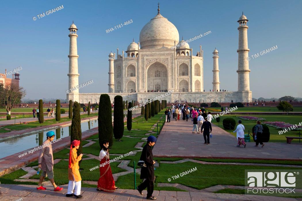 Stock Photo: Asian tourists at The Taj Mahal mausoleum southern view Uttar Pradesh, India.