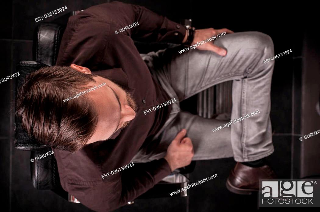 Stock Photo: Top view of the man in the chair for a haircut in hair salon or barber shop.