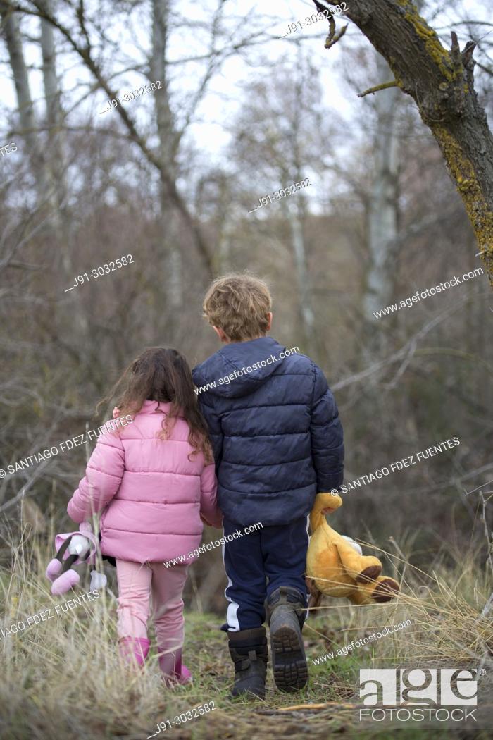 Two kids with their stuffed animals lost in forest, Stock Photo, Picture  And Rights Managed Image. Pic. J91-3032582 | agefotostock