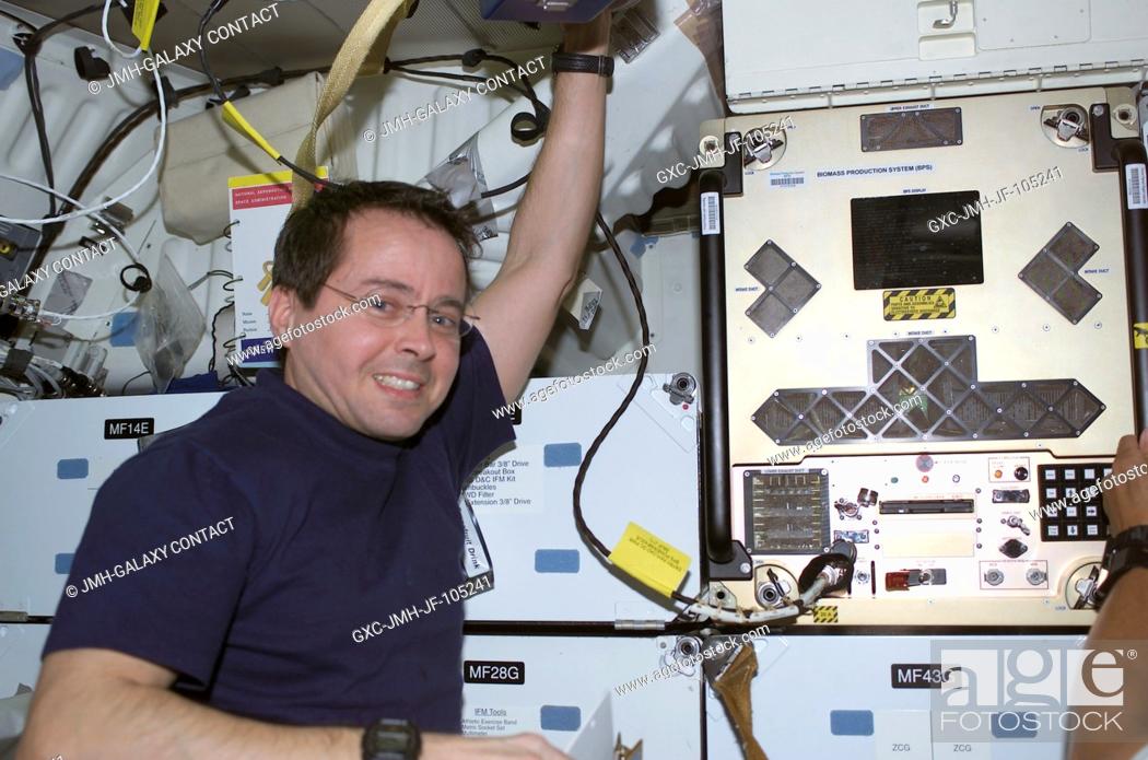 Stock Photo: Astronaut Daniel W. Bursch, who has been aboard the International Space Station (ISS) for the past six months, wastes little time in going to work on board the.