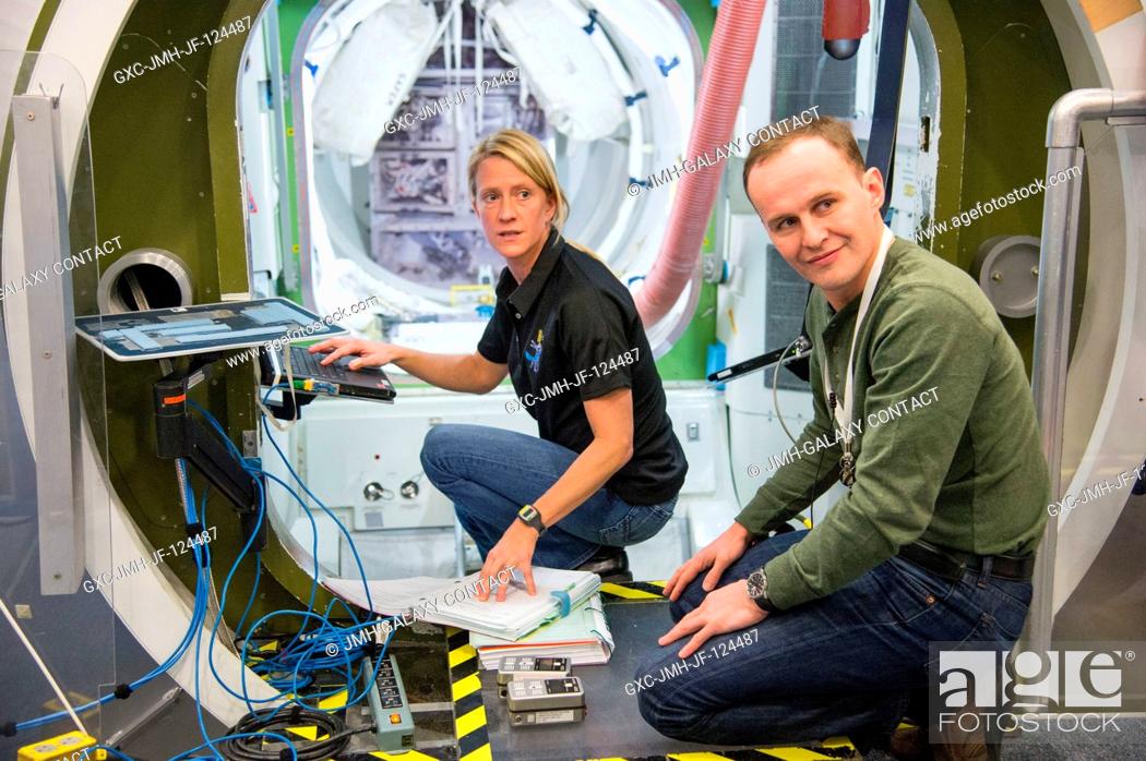 Stock Photo: NASA astronaut Karen Nyberg, Expedition 3637 flight engineer; and Russian cosmonaut Sergey Ryzansky, Expedition 3738 flight engineer.
