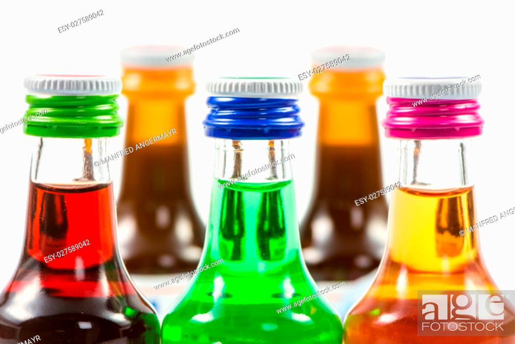 Stock Photo: Closeup of various isolated liqueur bottles with party drinks.