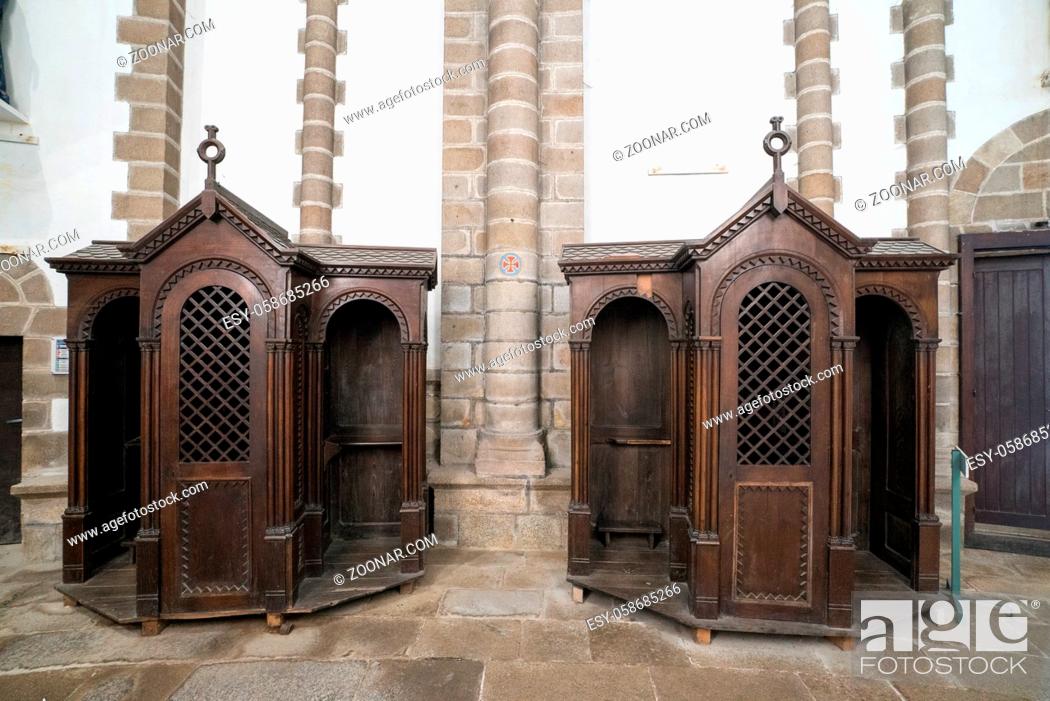 Stock Photo: Quimperle, Finistere / France - 24 August 2019: view of the confessional in the Abbey Sainte-Croix in Quimperle in Brittany.