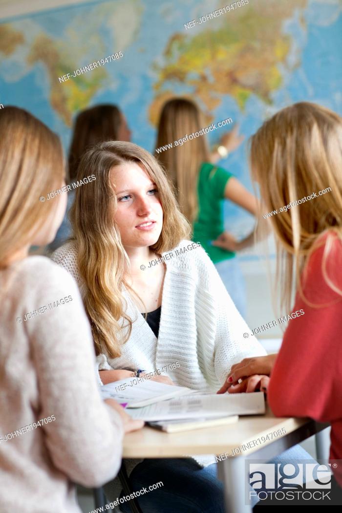 Stock Photo: Teenage girls in classroom, Stockholm, Sweden.
