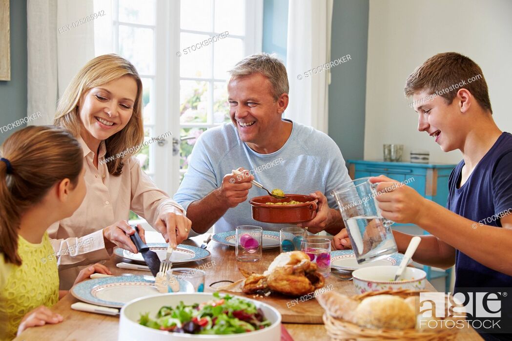 Stock Photo: Family Enjoying Meal At Home Together.