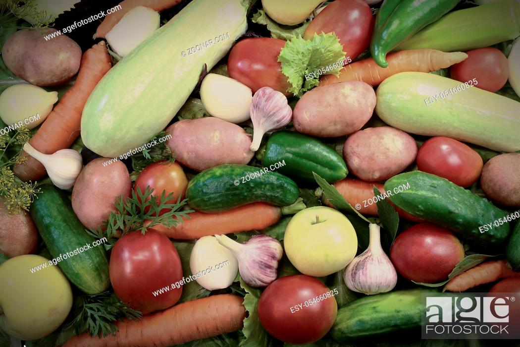 Stock Photo: Potatoes, tomatoes, zucchini , carrots and other fruits and vegetables. There are presented a big plan.g.