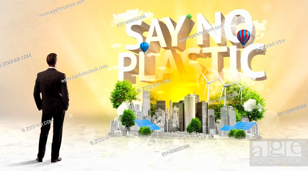 Stock Photo: Rear view of a businessman standing in front of SAY NO PLASTIC inscription, Environmental protection concept.