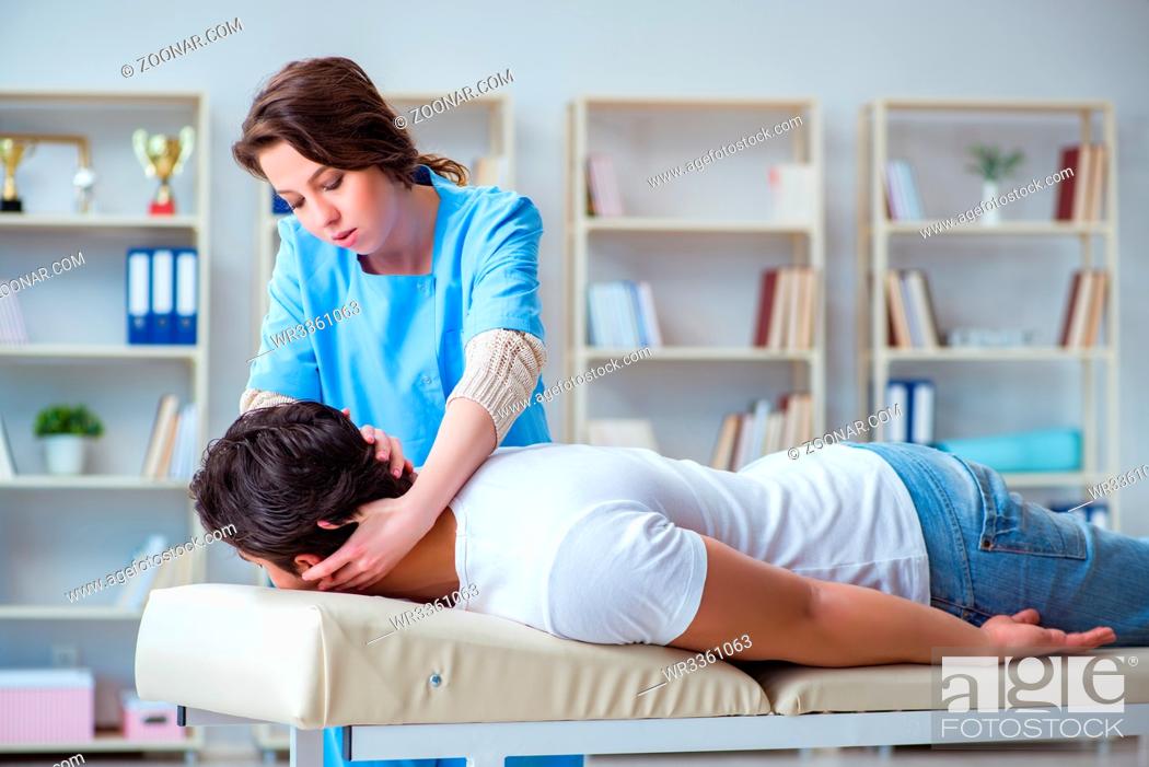 Stock Photo: Female chiropractor doctor massaging male patient.
