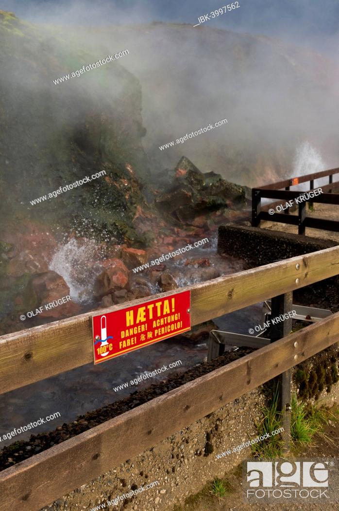 Stock Photo: Warning sign on a fence, hot spring Deildartunguhver, highest-flow hot spring of Iceland with 180 liters of boiling water per second, Reykholtsdalur, Iceland.