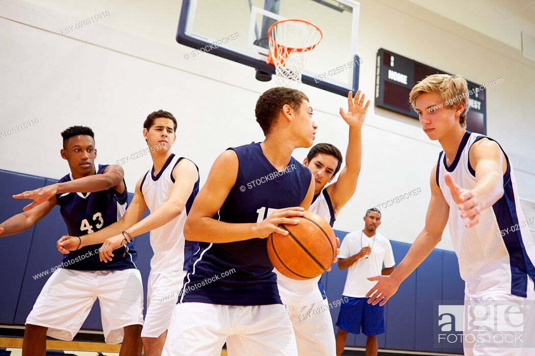 Stock Photo: Male High School Basketball Team Playing Game.