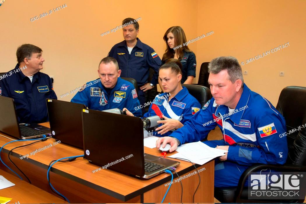 Stock Photo: At the Cosmonaut Hotel crew quarters in Baikonur, Kazakhstan, Expedition 4142 Soyuz Commander Alexander Samokutyaev of the Russian Federal Space Agency.