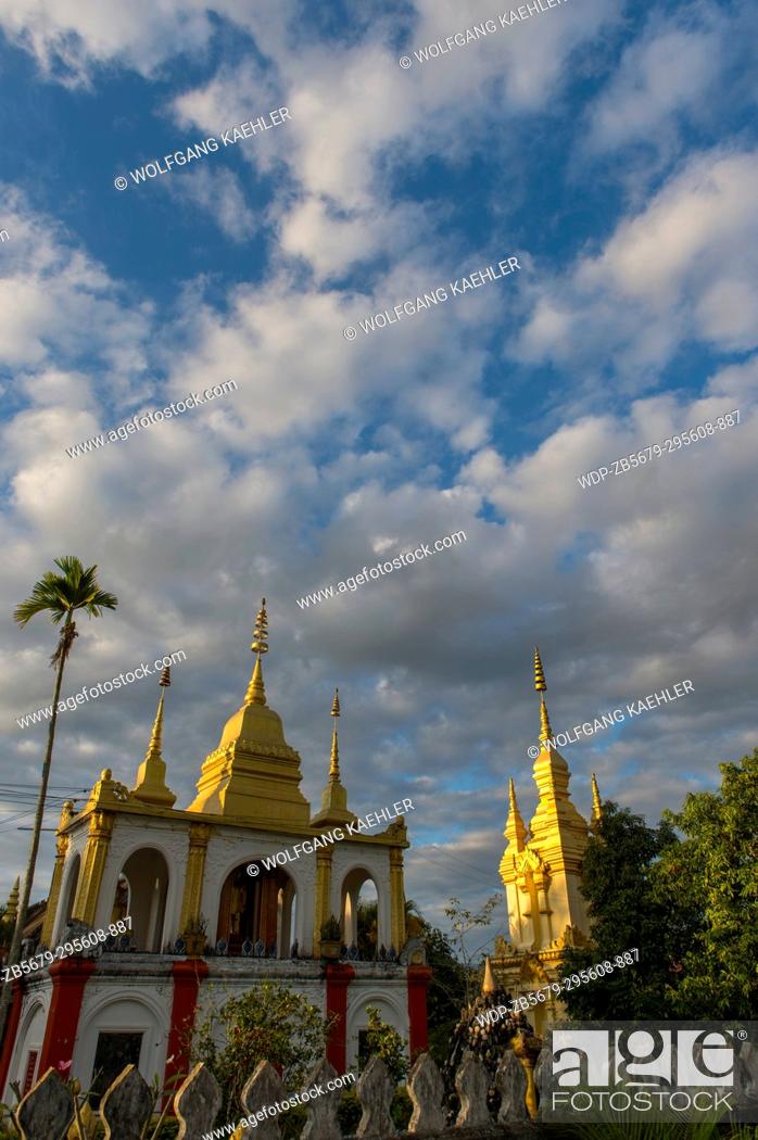 Stock Photo: The evening light on the gilded stupa of Wat Prabat Tay (Wat Phra Bat Tai) in in the UNESCO world heritage town of Luang Prabang in Central Laos.