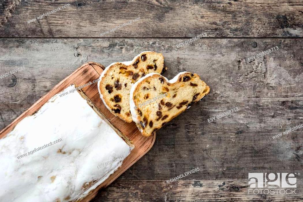 Stock Photo: Christmas stollen. Traditional German Christmas dessert on wooden background.