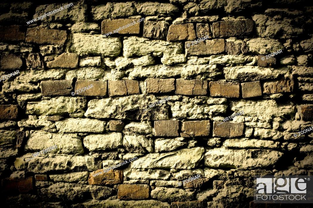 Stock Photo: old stone wall background.