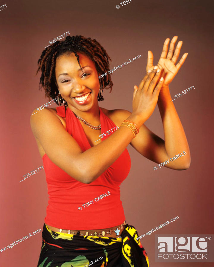 Woman in Jamaican apparel, dreadlocks hair style, Stock Photo, Picture And  Rights Managed Image. Pic. S25-521771 | agefotostock