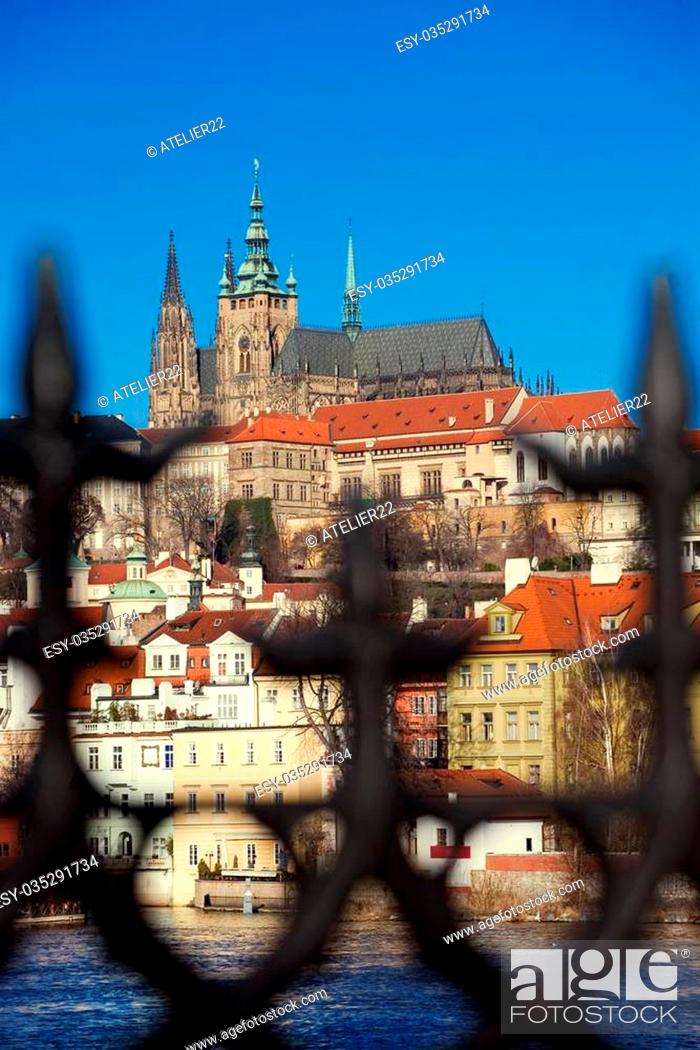 Stock Photo: Prague castle seen thorugh stylized metal fence on the Charles' Bridge.