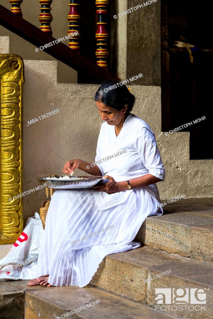 Stock Photo: Sri Lanka, Kandy, Sri Dalada Maligawa, the Temple of the Sacred Tooth, elderly woman, rice bowl.