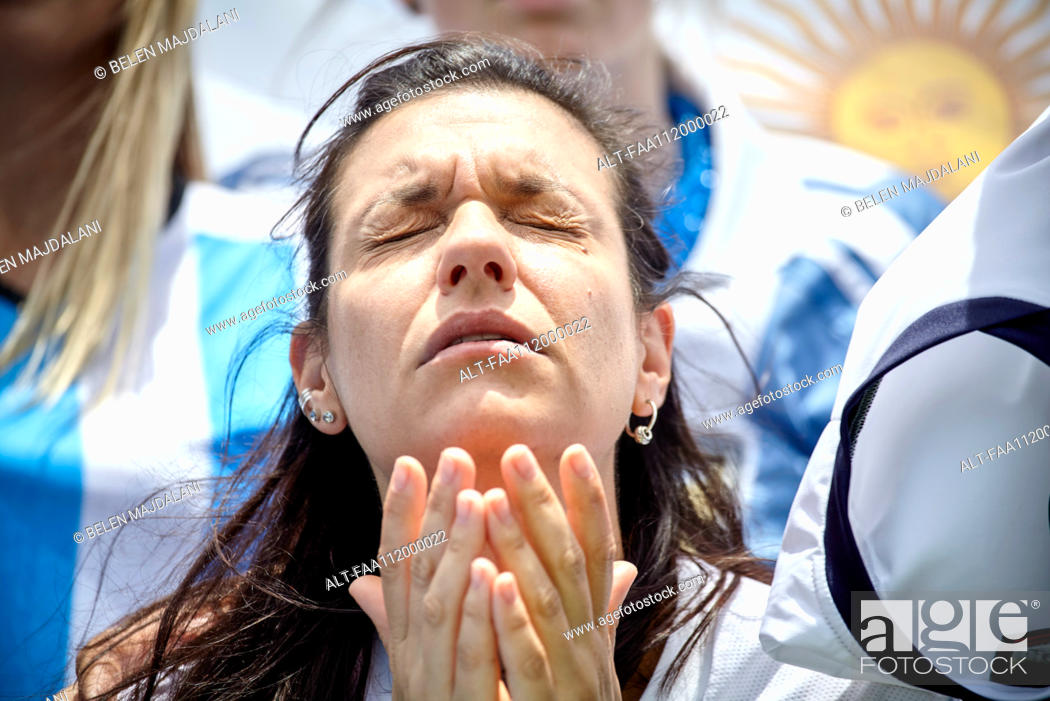 Stock Photo: Argentinian football fan with anguished expression on face at match.