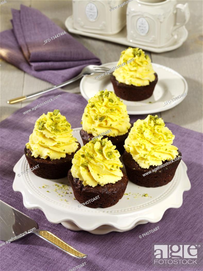 Stock Photo: Saffron and date cupcakes with pistachios.