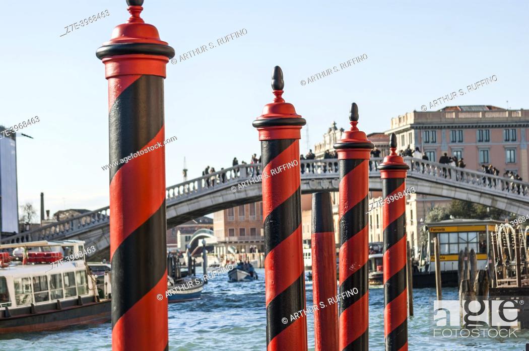 Stock Photo: Venetian Paline de Casada (Venetian poles with stripes/mooring posts). The canals of Venice. Venice, Veneto Region, Italy, Europe.