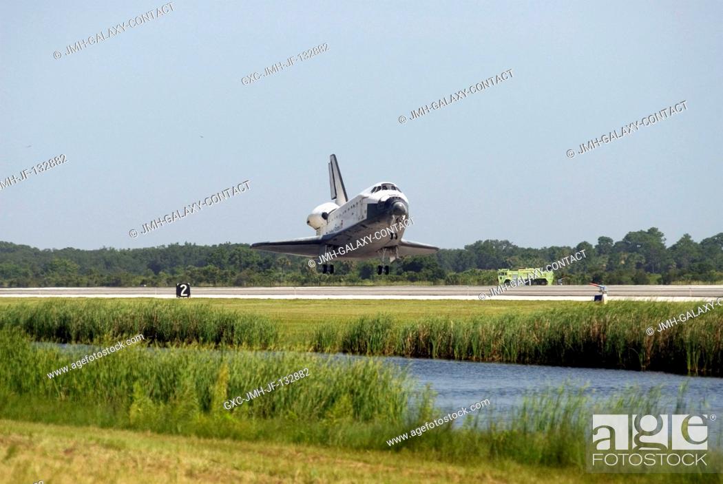 Stock Photo: Space Shuttle Endeavour approaches landing Runway 15 of the Shuttle Landing Facility at NASA's Kennedy Space Center, concluding the 16-day, 6.