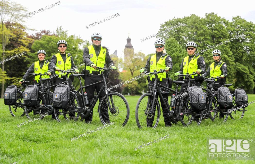 Stock Photo: 15 May 2019, Saxony, Leipzig: The officials of the new bicycle squadron of the Ordnungsamt Leipzig are standing in the Johannapark.