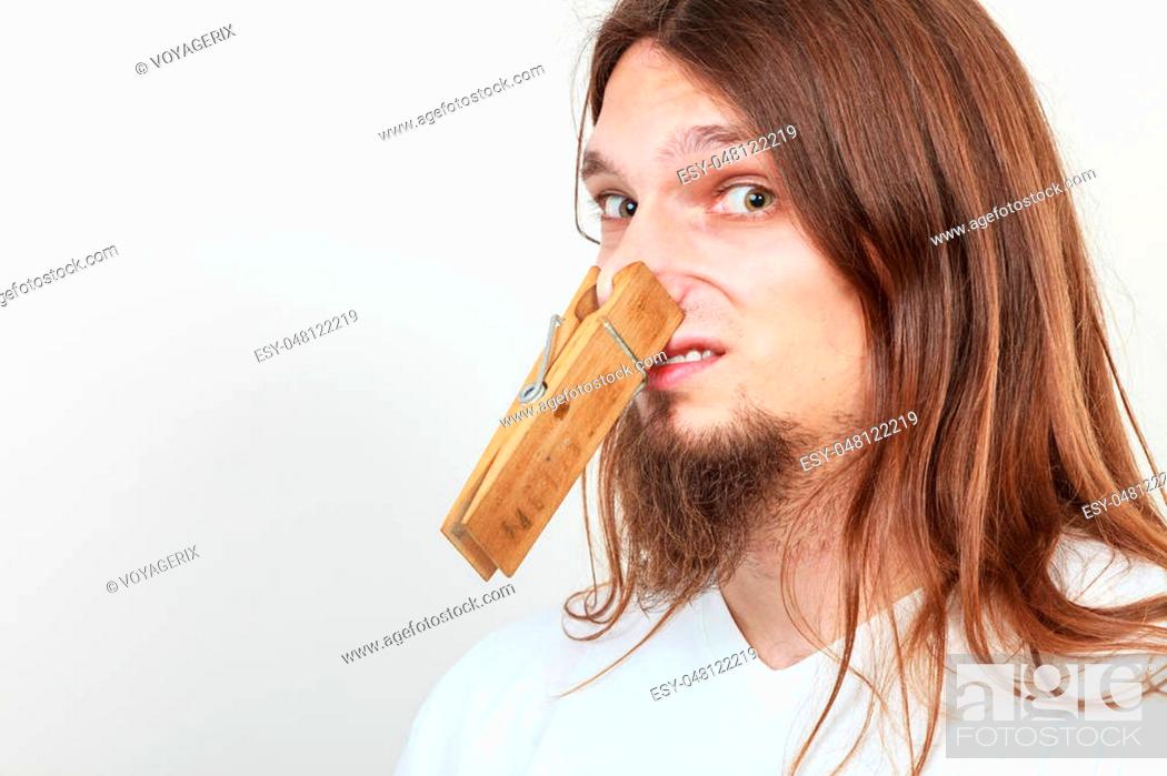 web Prohibir incrementar Man with clothespin clip peg on his nose. Young long haired guy feeling  unpleasant odor stink, Stock Photo, Picture And Low Budget Royalty Free  Image. Pic. ESY-048122219 | agefotostock