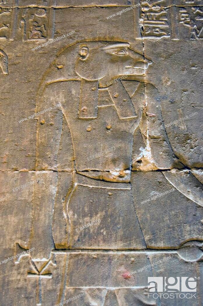 Stock Photo: Ancient Egyptian hieroglyphic carving of the baboon headed god Baba. Interior wall of the Temple of Horus at Edfu, Egypt.