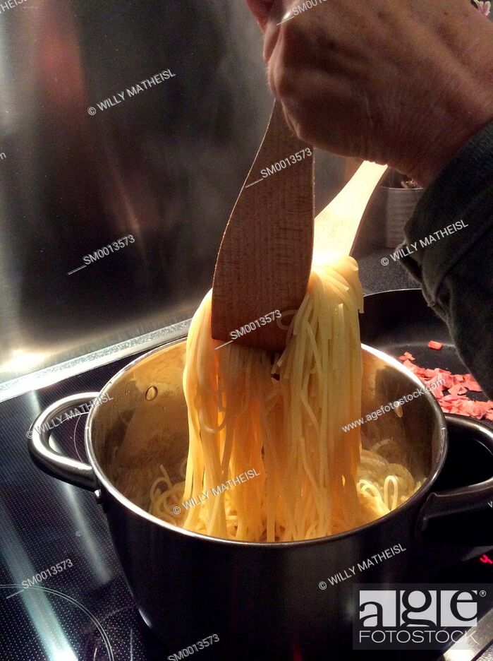Stock Photo: spaghetti cooking in a pot.
