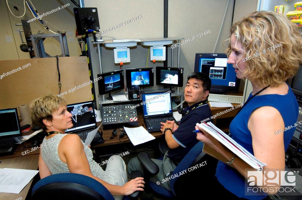 Stock Photo: Astronauts Peggy Whitson, Expedition 16 commander; and Dan Tani, Expedition 1516 flight engineer, participate in a training session in the virtual reality lab.