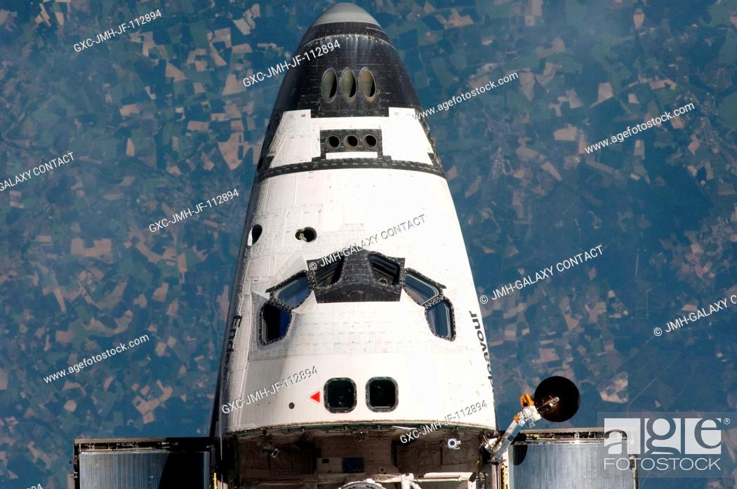 Stock Photo: This view of the nose and crew cabin of the space shuttle Endeavour was provided by an Expedition 27 crew member during a survey of the approaching STS-134.