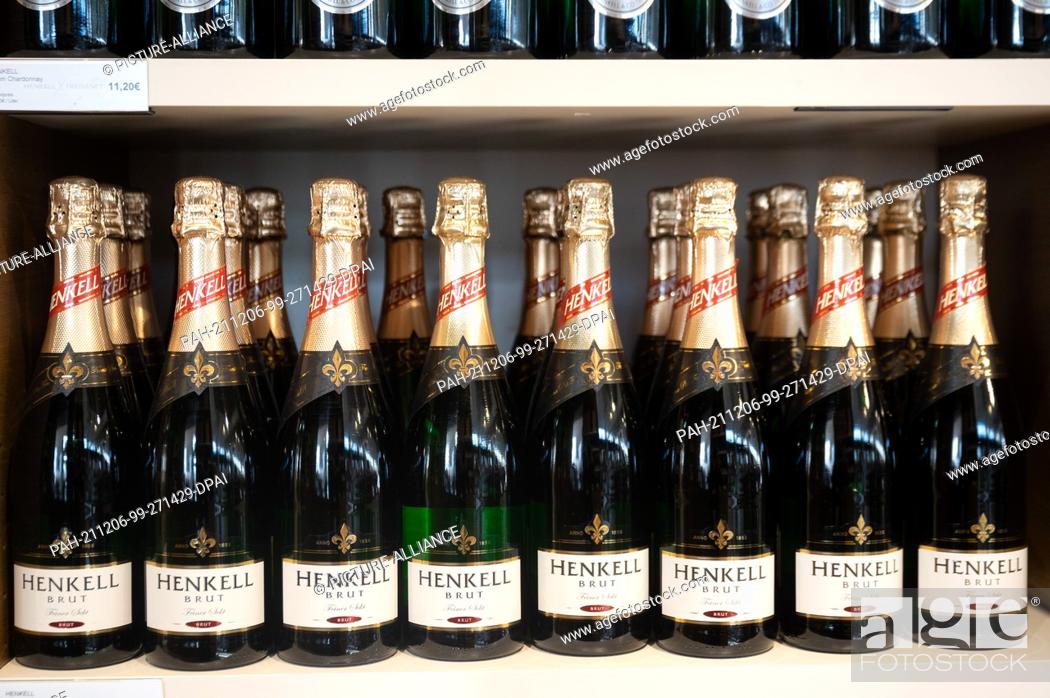 Stock Photo: 09 November 2021, Hessen, Wiesbaden: Bottles of Henkell sparkling wine stand in the sales room at the Henkell & Co. sparkling wine cellar.