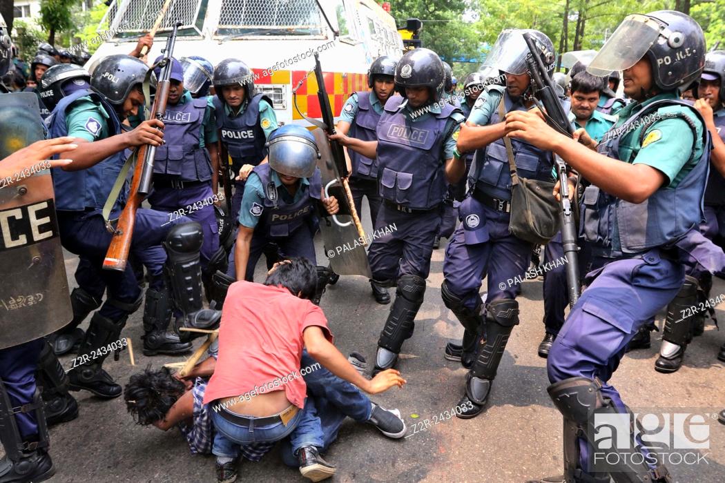 Stock Photo: Dhaka 10 May 2015: Police maul protesters during a march to besiege Dhaka police headquarters demanding action over the sexual assault on women during Pahela.