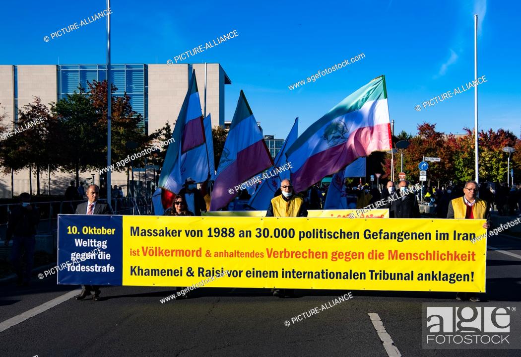 Stock Photo: 09 October 2021, Berlin: Numerous supporters of the National Council of Resistance of Iran demonstrate against the government in Iran in front of the.