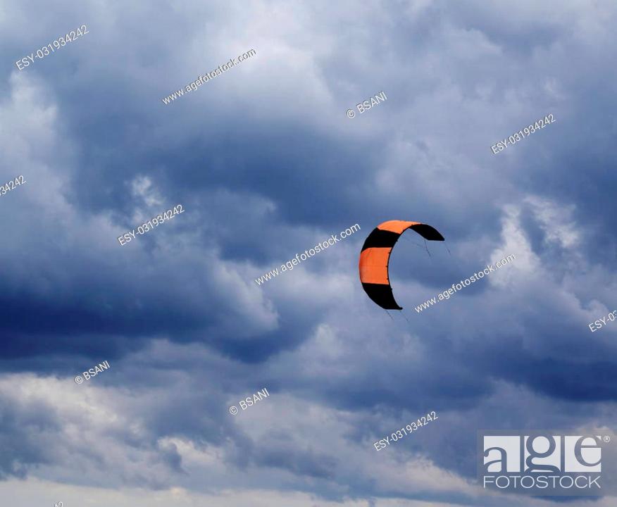 Stock Photo: Power kite in Black Sea and gray sky.