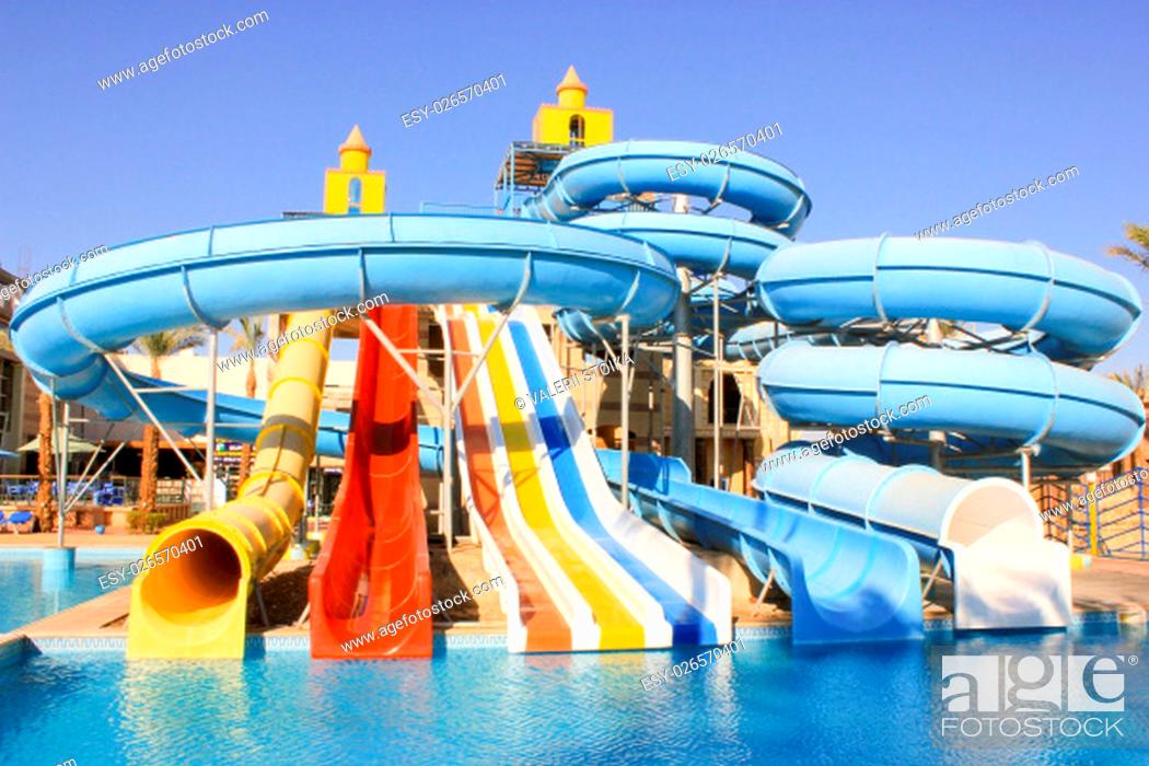 Stock Photo: Water Slides at the Water Aquapark. Water Park for Kids at Sun Light.