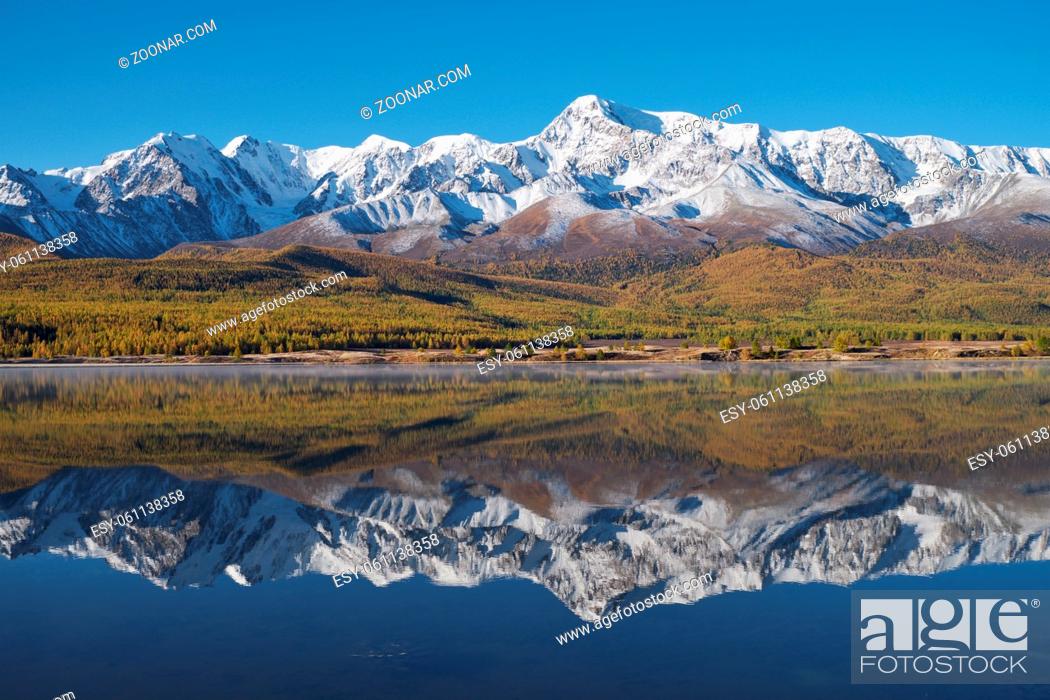 Stock Photo: View on Altai lake Dzhangyskol on mountain plateau Eshtykel. North Chui ridge is reflecting in the water. Altai, Siberia, Russia.