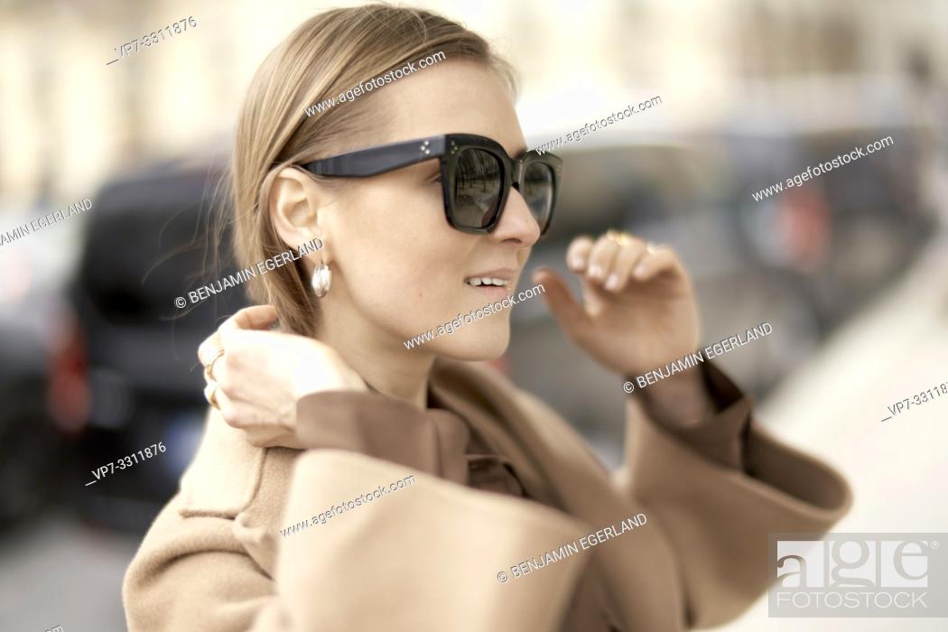 Stock Photo: fashionable blogger woman during fashion week, in city Paris, France.