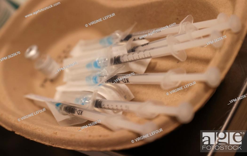 Stock Photo: Illustration picture shows preparation of a vaccine shot, during the vaccination of the residents of the Quietude elderly home in Montigny-le-Tilleul.