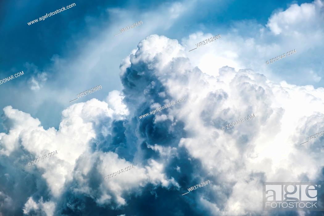 Stock Photo: Dramatic sky, light from heaven. Cumulus stormy clouds in summer. Background.