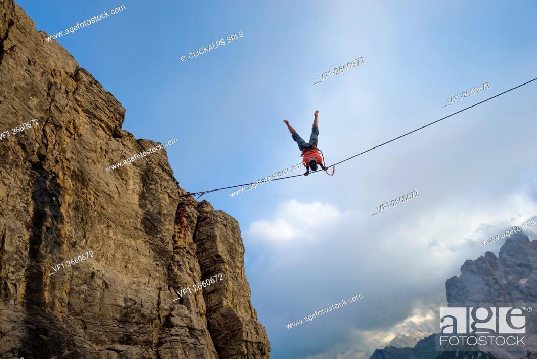 Stock Photo: Monte Piana, Auronzo, Misurina, Dolomiti, Veneto, Italy, Man doing an Highline (slackline).