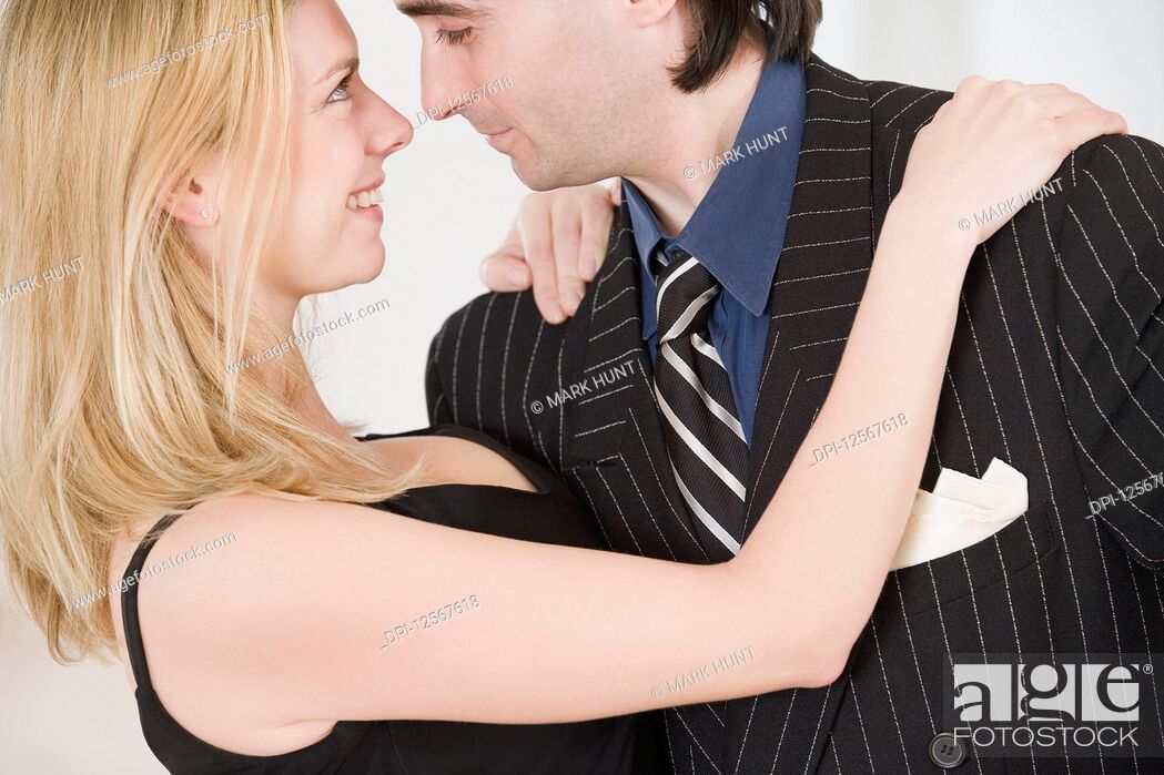 Stock Photo: Close-up of a mid adult couple dancing Argentine Tango.