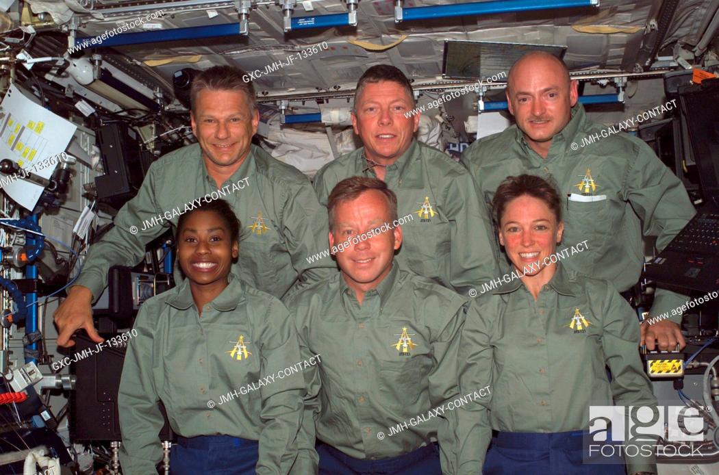 Stock Photo: The STS-121 crewmembers gather for an in-flight crew photo in the Destiny laboratory of the International Space Station. From the left (bottom) are astronauts.