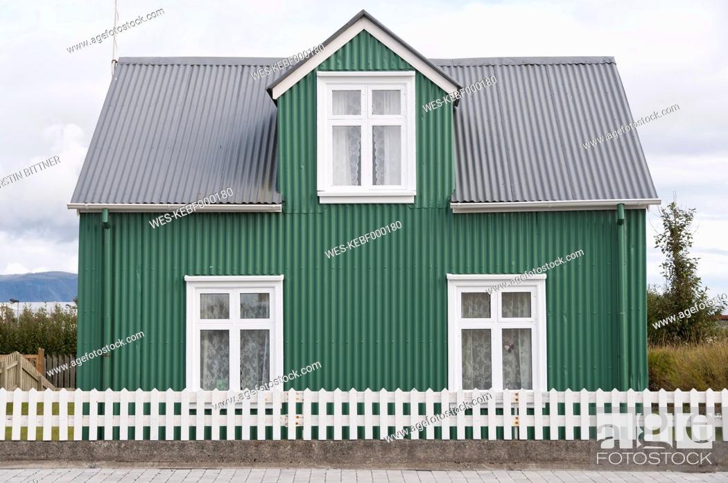Stock Photo: Iceland, Eyrarbakki, small green one-family house.