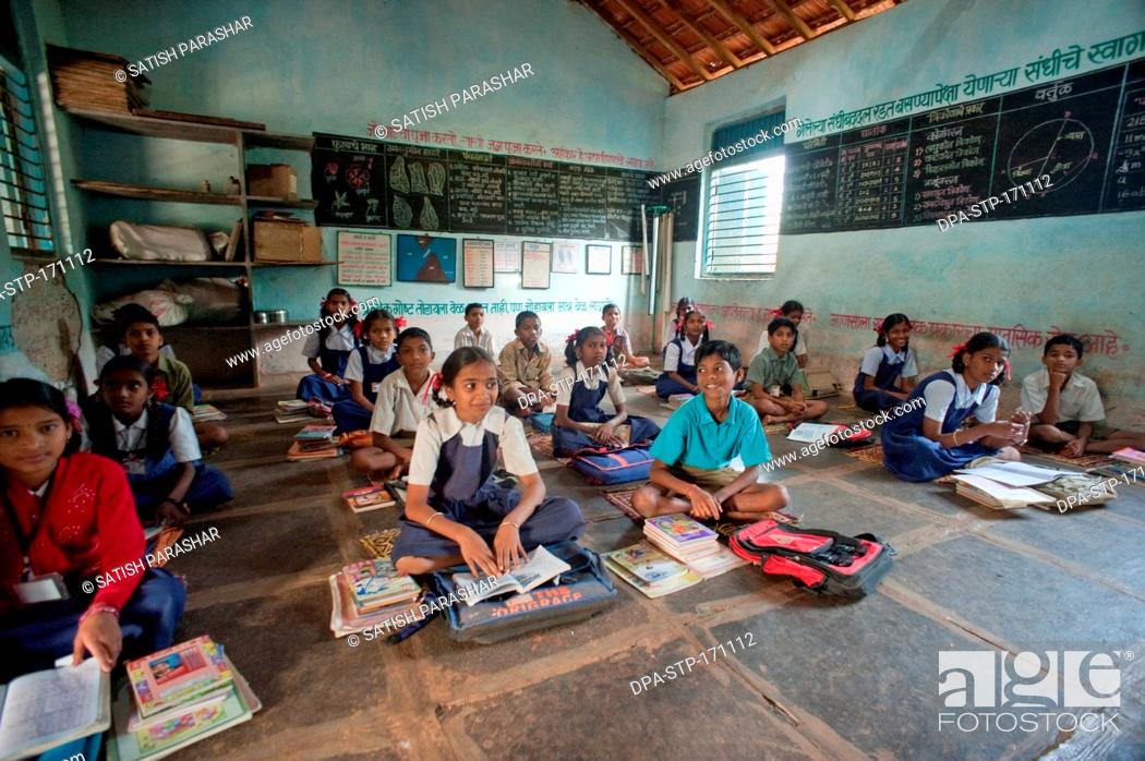 Stock Photo: Girls and boys learning in classroom at Rajwadi ; Sangmeshwar ; Ratnagiri ; Maharashtra  ; India NOMR.