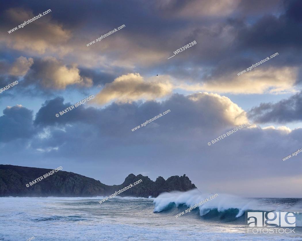 Photo de stock: Huge surf looking out towards Logan Rock at Porthcurno, Cornwall, England, United Kingdom, Europe.