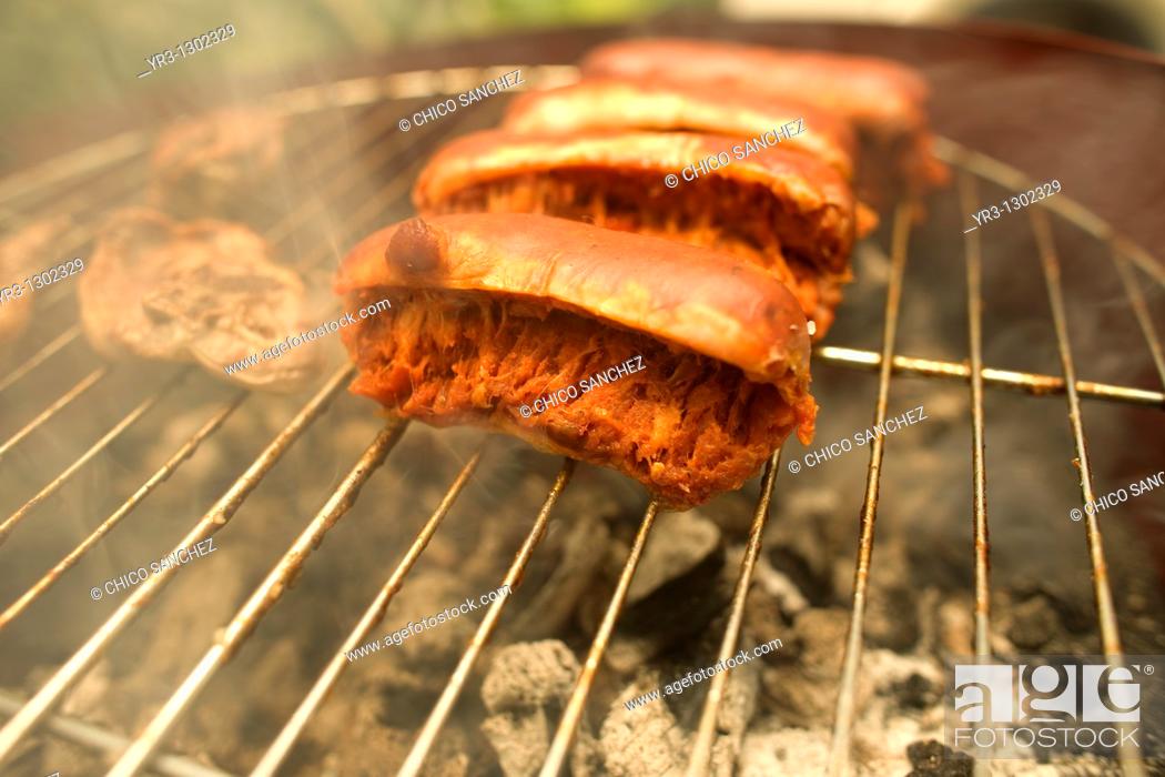 Stock Photo: Sausage, or chorizo, is grilled in Prado del Rey, Sierra de Cadiz, Cadiz province, Andalusia, Spain, May 23, 2010.
