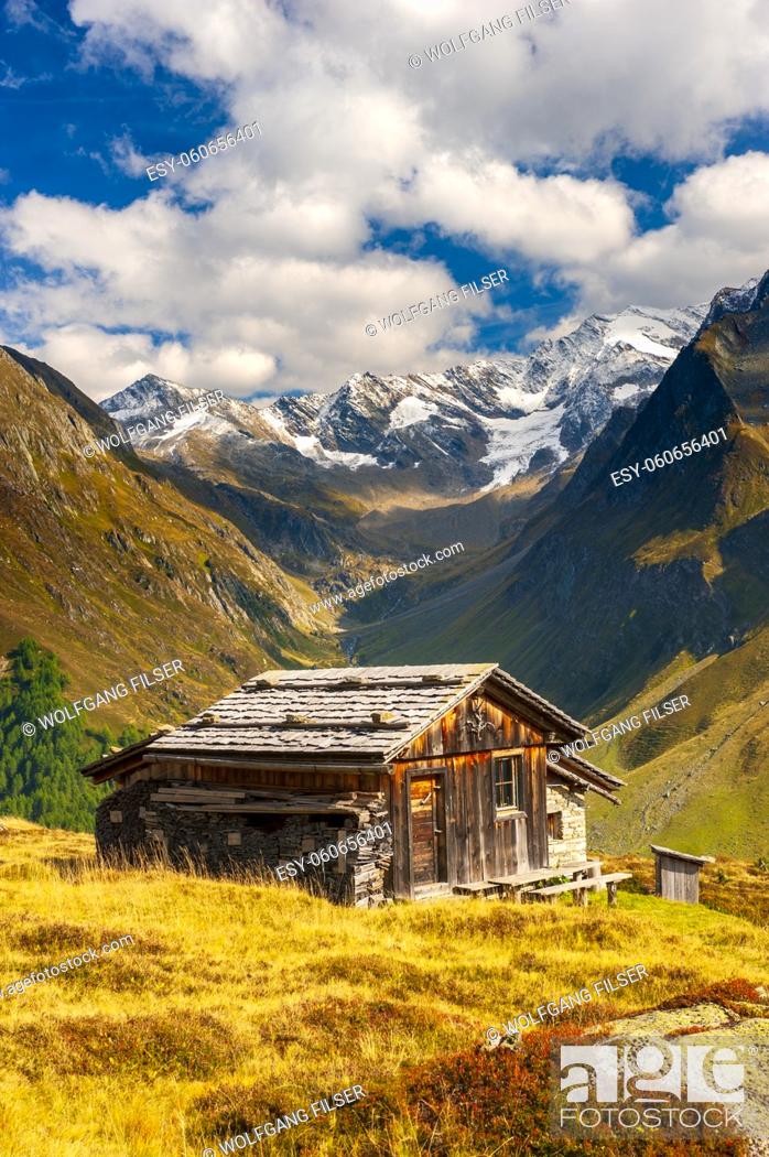 Stock Photo: panoramic mountain range with wooden hut.